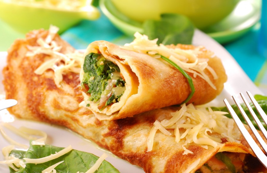 Rolled pancakes stuffed with the spinach